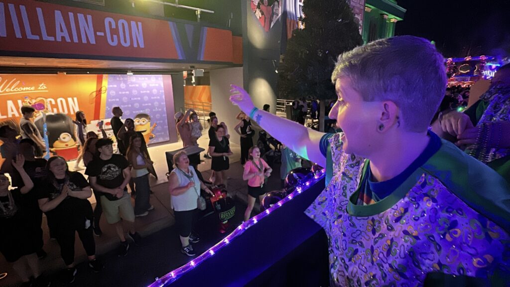 throwing beads from Universal Mardi Gras parade float